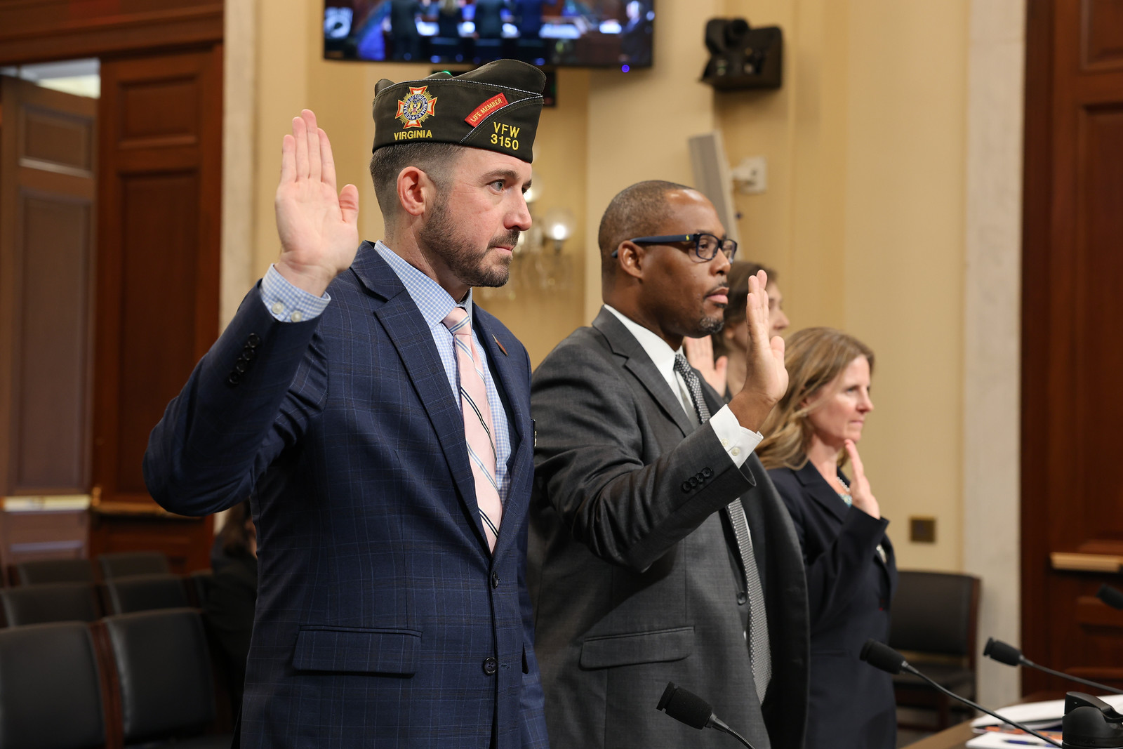 Veterans testify before Congress, raising their hands in oath, advocating for a legislative platform for veterans' issues.