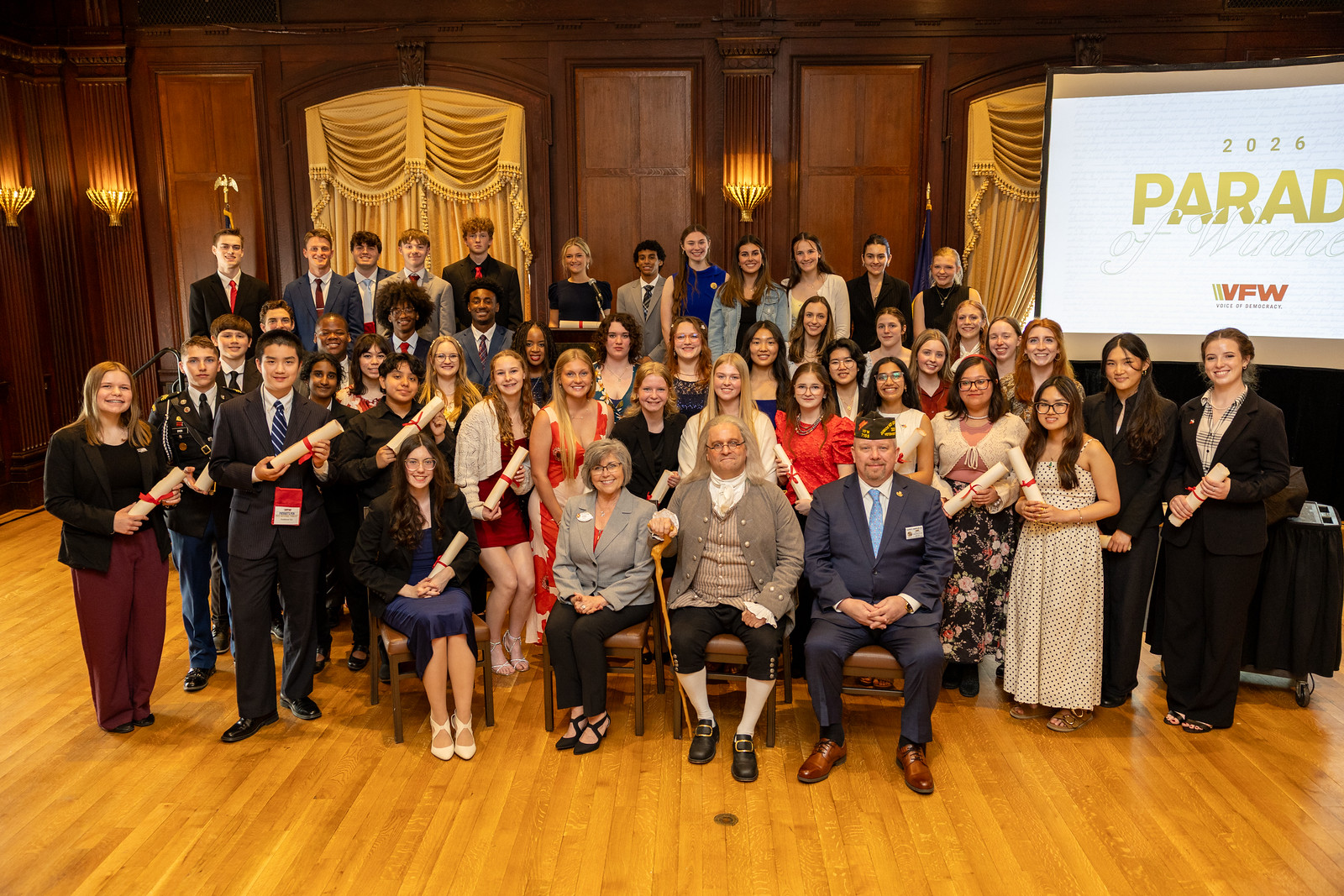 Group photo of diverse participants celebrating achievements at the 2026 Parade of Winners event hosted by VFW.