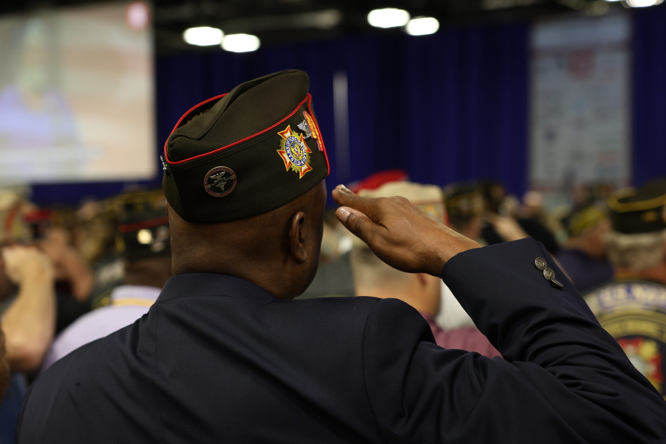 Man in VFW cap saluting
